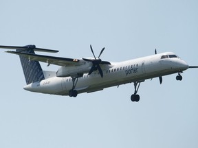 A Porter airlines flight makes its final approach as it lands at the airport Tuesday July 2, 2019 in Ottawa.