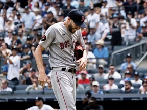 Boston Red Sox starting pitcher Chris Sale walks off the mound after a hand injury during the second inning of a baseball game against the New York Yankees, Sunday, July 17, 2022, in New York.