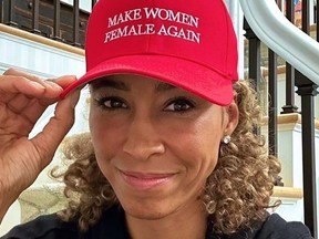 Sage Steele wearing red baseball cap with "Make Women Female Again" on it.