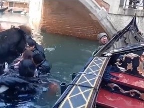 Screengrab of tourists in canal in Venice after gondola capsize.