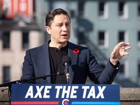 Conservative Leader Pierre Poilievre holds a press conference regarding his "Axe the Tax" message from the roof a parking garage in St. John's on Friday, Oct.27, 2023.
