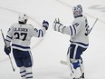 Toronto Maple Leafs goaltender Martin Jones celebrates with defenceman Timothy Liljegren after defeating the San Jose Sharks.