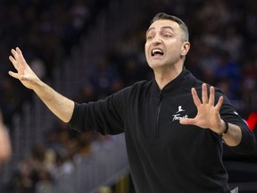 Toronto Raptors head coach Darko Rajakovic calls out instructions to his players.