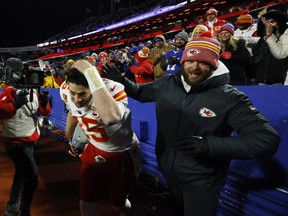 Patrick Mahomes of the Kansas City Chiefs dodges snowballs thrown by fans after defeating the Buffalo Bills in the AFC Divisional Playoff game.