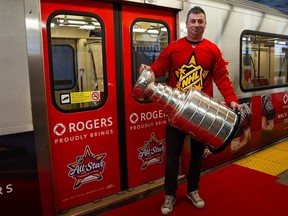 Former Toronto Maple Leafs defenceman Tomas Kaberle and the Stanley Cup disembark a TTC subway car at Union Station in Toronto on Monday, Jan. 22, 2024.