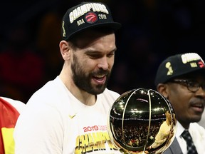 Marc Gasol #33 of the Toronto Raptors celebrates with the Larry O'Brien Championship Trophy after his team defeated the Golden State Warriors to win Game Six of the 2019 NBA Finals at ORACLE Arena on June 13, 2019 in Oakland, California.