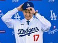 Japanese baseball player Shohei Ohtani attends a press conference on his presentation after signing a ten-year deal with the Los Angeles Dodgers.