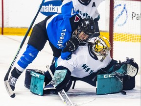 Samantha Cogan (17) of Toronto goes to the net against Corinne Schroeder (30) of New York during the second period of their PWHL hockey game at the Mattamy Athletic Centre in Toronto on Monday, Jan. 1, 2024.