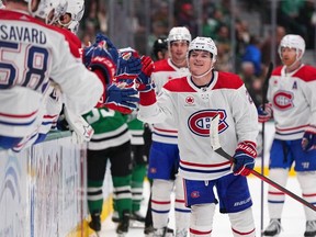 Canadiens' Cole Caufield celebrates with his teammates after scoring a goal for the third straight game Tuesday night in Dallas.