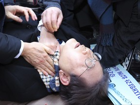 South Korean opposition leader Lee Jae-myung is seen after he was injured in Busan, South Korea, Tuesday, Jan. 2, 2024. Lee was attacked and injured by an unidentified man during a visit Tuesday to the southeastern city of Busan, emergency officials said.