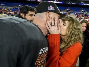 Taylor Swift kisses Kansas City Chiefs tight end Travis Kelce after the AFC Championship game against the Baltimore Ravens, Sunday, Jan. 28, 2024, in Baltimore.