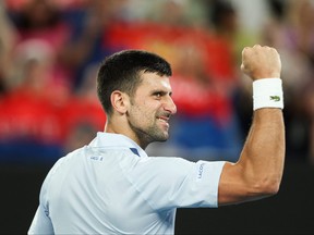 Serbia's Novak Djokovic celebrates after victory against France's Adrian Mannarino during their men's singles match on day eight of the Australian Open tennis tournament in Melbourne on Jan. 21, 2024.