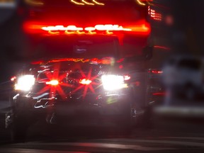 An ambulance rushes to the scene of an accident.