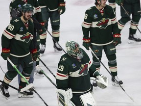 Minnesota Wild goaltender Marc-Andre Fleury reacts after winning 5-0 an NHL hockey game against the New York Islanders, Monday, Jan. 15, 2024, in St. Paul, Minn. Fleury passed Patrick Roy for second place on NHL career wins with 552.