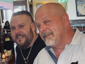 This undated photo provided by Laura Herlovich shows from left, Adam and Rick Harrison