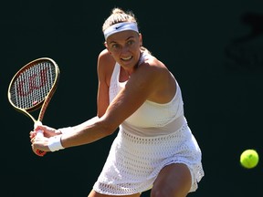 Petra Kvitova plays a backhand against Aliaksandra Sasnovich during Wimbledon at All England Lawn Tennis and Croquet Club on July 7, 2023 in London.