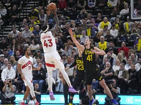 Toronto Raptors forward Pascal Siakam (43) shoots as Utah Jazz forward Kelly Olynyk (41) defends during the first half of an NBA game on Jan. 12, 2024, in Salt Lake City.