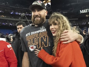 Kansas City Chiefs tight end Travis Kelce walks with Taylor Swift following the AFC Championship game Sunday, Jan. 28, 2024, in Baltimore.