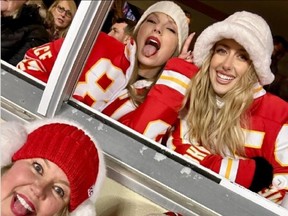 Beth Vancil poses alongside Taylor Swift and Brittany Mahomes at Saturday's Chiefs-Dolphins game.