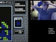 In this image taken from video, 13-year-old player named Willis Gibson reacts after playing a game of Tetris.