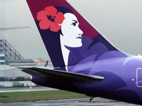 The tail of a Hawaiian Airlines aircraft parked at Manila international airport on June 16, 2008.