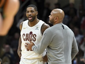 Cleveland Cavaliers' Tristan Thompson, left, is held back by head coach J.B. Bickerstaff, after Thompson was called for a technical foul during the second half of an NBA basketball game against the Washington Wizards, Friday, Jan. 5, 2024, in Cleveland. Cleveland centre Thompson has been suspended 25 games by the NBA for violating its anti-drug program.