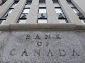 A Bank of Canada survey finds Canadians are increasingly cutting back on spending while mortgage holders remain confident they can keep up with higher payments when their contracts renew. A Bank of Canada sign is seen in Ottawa, Monday, May 25, 2020.