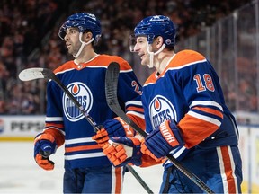 Edmonton Oilers' Evan Bouchard (2) and Zach Hyman (18) celebrate a goal against the Philadelphia Flyers during second period NHL action in Edmonton, Tuesday, Jan. 2, 2024.