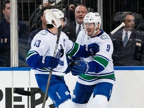Canucks centre J.T. Miller celebrates his goal with captain Quinn Hughes on Jan.8 at Madison Square Garden. They are key cogs in the leadership group,