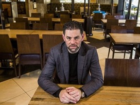 Mohamad Fakih, CEO of Paramount Fine Foods, is pictured during the pandemic in the empty dining room at his west-end location at 1585 The Queensway on Oct. 23, 2020. (Ernest Doroszuk, Toronto Sun)