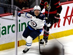 Winnipeg Jets left wing Nikolaj Ehlers (27) celebrates his goal to win the game against the Ottawa Senators during overtime NHL hockey action in Ottawa, on Saturday, Jan. 20, 2024.