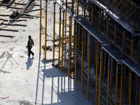 A construction worker is shown at a building site in Ajax, Ont., on Thursday, Nov., 30, 2023.