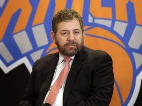 New York Knicks owner James Dolan listens to a question during a news conference on March 18, 2014, in New York.