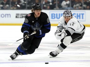 William Nylander of the Toronto Maple Leafs skates away from Trevor Moore of the Los Angeles Kings at Crypto.com Arena on January 2, 2024 in Los Angeles.