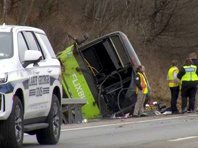 This still image from WTEN-TV video shows emergency response personnel at the site of a roll over bus accident on the Adirondack Northway, in the town of Lake George, N.Y., Friday, Jan. 5, 2024.