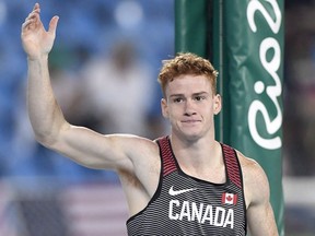 Shawn Barber waves to the crowd after being eliminated at 5.65 metres in the men's pole vault final during the athletics competition at the 2016 Summer Olympics in Rio de Janeiro, Brazil on August 15, 2016.