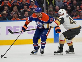 Edmonton Oilers Evander Kane (91) skates past Vegas Golden Knights Ivan Barbashev (49) during first period NHL action on Tuesday, Nov. 28, 2023 in Edmonton.