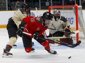 Ottawa's Mikayla Grant-Mentis battles in front of the net Tuesday night during first-period action in the home opener against Montreal at the TD Place Arena.