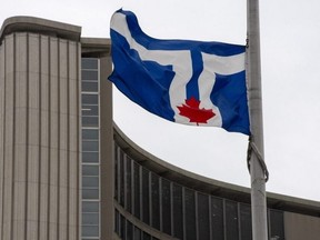 The City of Toronto says one of its construction crews found "ancient" human remains in the Gerrard St.-Danforth Ave. area. Pictured: The City of Toronto flag flies at City Hall in Toronto on April 9, 2021. (The Canadian Press, Frank Gunn)