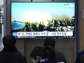 A TV screen shows a file image of North Korea's military exercise during a news program at the Seoul Railway Station in Seoul, South Korea, Sunday, Jan. 7, 2024.
