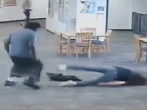 Screenshot of student Brendon Depa beating teacher Joan Naydich until she loses consciousness.