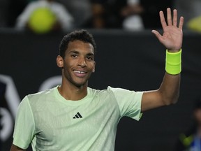 Felix Auger-Aliassime reacts after defeating Hugo Grenier in their second round match at the Australian Open at Melbourne Park, Thursday, Jan. 18, 2024.