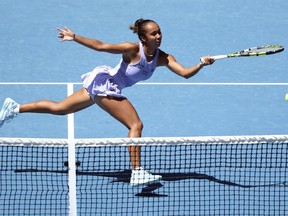 Leylah Fernandez plays a forehand return to Sara Bejlek during their first round match at the Australian Open at Melbourne Park, Melbourne, Australia, Sunday, Jan. 14, 2024.