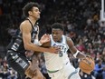 Minnesota Timberwolves' Anthony Edwards (5) drives against San Antonio Spurs' Dominick Barlow during the first half of an NBA basketball game, Saturday, Jan. 27, 2024, in San Antonio.