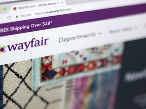 Wayfair says about 50 Canadians are part of a layoff impacting 1,650 employees at the furniture company.This April 17, 2018, file photo shows the Wayfair website on a computer in New York.