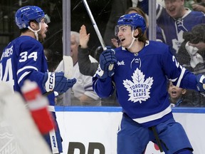 Toronto Maple Leafs' Matthew Knies (23) celebrates his goal with teammate Auston Matthews.