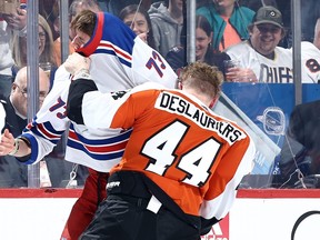 Matt Rempe of the New York Rangers and Nicolas Deslauriers of the Philadelphia Flyers fight.