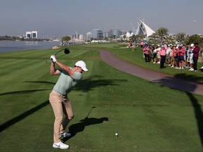 Rory McIlroy of Northern Ireland tees off on the 18th hole on Day One of the Dubai Invitational at Dubai Creek Golf and Yacht Club.