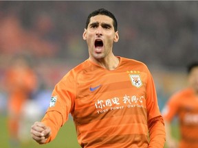 Marouane Fellaini of Shandong Luneng celebrates after scoring during the Chinese Super League (CSL) football match between Shandong Luneng and Beijing Renhe, in Jinan in China's eastern Shandong province on March 1, 2019. Former Belgium international Marouane Fellaini, 36, announced on Instagram on February 3, 2024, that he is ending his career three months after the end of his contract with Chinese club Shandong Taishan.