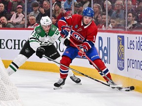 Canadiens' Alex Newhook (15) skates the puck against Thomas Harley of the Dallas Stars at the Bell Centre on Saturday, Feb. 10, 2024, in Montreal.